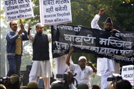 afp : Indian Muslims hold placards as they shout slogans during a protest in New Delhi on December 6, 2008, to mark the 16th anniversary of the razing of the Babri Masjid mosque