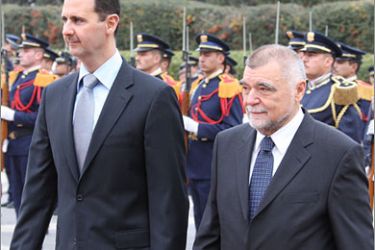 AFPSyrian President Bashar al-Assad (L) welcomes his Croatian counterpart Stipe Mesic at the presidential palace in Damascus on December 22, 2008