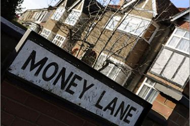 REUTERS / Houses are seen behind a residential street sign in London December 1, 2008. British lender Royal Bank of Scotland on Monday said it would not repossess the homes of mortgage