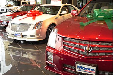 AFPThis December 16, 2008 photo shows Cadillacs and a Hummer, displayed at a dealership in Chantilly, Virginia. GM has said it will run out of money by