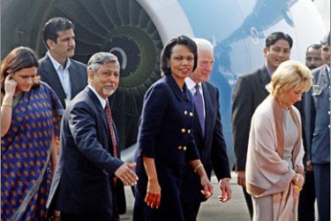 AFPUS Secretary of State Condoleezza Rice (4-L) walks alongside US Ambassador to India David C. Mulford (5-L) as she arrives at New Delhi's Air Force