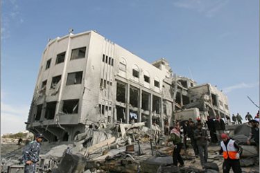 AFPPalestinians stand at the site of the destroyed former office of Palestinian president Mahmud Abbas following an Israeli air strike in Gaza City