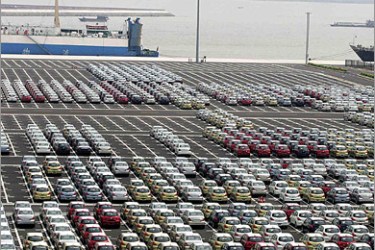 AFP (FILES) Photo taken November 16, 2008 shows Chinese made cars waiting to be loaded at the port of Guangzhou, southern China's Guangdong province. Car sales in China