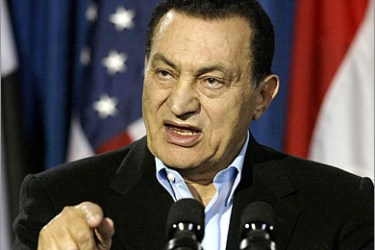 AFP (FILES) In a file picture dated April 12 2004 Egyptian President Hosni Mubarak speaks to reporters during a press conference from the press center next to Bush's Crawford