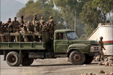 afp ; Pakistani troops return to base after completing a mission against militants in Jamrud on January 2, 2009. Pakistani security forces briefly reopened a key northwest