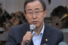 UN Secretary General Ban Ki-moon speaks during a press conference as he stands in front of the remains of rockets fired by Palestinian militants from the Gaza Strip