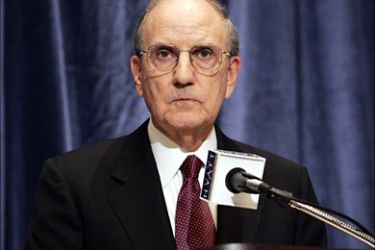 f_File picture of investigator George J. Mitchell listening to a question as he announces results of his 20-month investigation into performance-enhancing drug use
