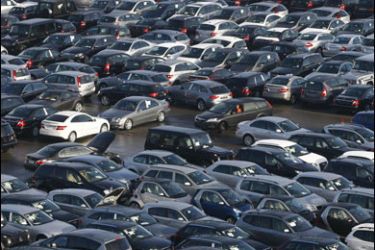 r/Cars are parked in the car park of a car re-import company in Emmering near Munich, in this December 8, 2008 file picture. Car imports and exports at the German port of Bremerhaven nose-dived at the start of this year, the port's biggest goods handler said on February 4, 2009,