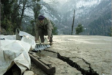 AFP - In this picture taken on February 20, 2009, shows an elderly Pakistani Kashmiri man covers a crack after a 5.4-magnitude earthquake in the outskirt of Muzaffarabad. A 5.4-magnitude moderate earthquake jolted capital Islamabad and