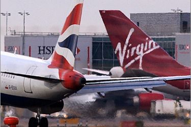 AFP - A British Airways and a Virgin Atlantic planes are pictured at London's Heathrow airport, on February 13, 2009. As many as 600 jobs are at risk at Sir Richard Branson's airline Virgin