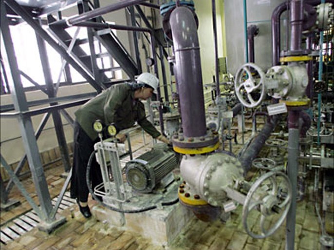 f_A file picture dated April 3, 2007 shows a female Russian technician checking equipment inside the Bushehr nuclear power plant, in the Iranian Persian Gulf port