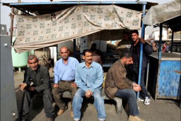 afp : Iraqi unemployed men sit waiting to be hired for casual labor in central Baghdad on February 16 2009. Iraq is employing too many people in government jobs and a