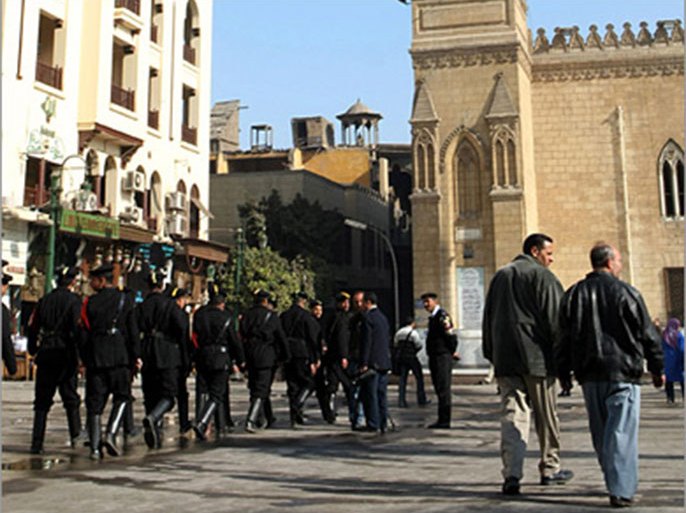 AFP - A column of Egyptian police walk through the usually busy plaza outside the Al-Hussein mosque on February 23, 2009, the scene of a deadly bomb blast the previous night.