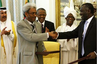 AFP - Sudanese rebel group Justice and Equality Movement (JEM) member Jibril Ibrahim (R) shakes hands with Sudanese government representative Amin Hassan Omar (L) after