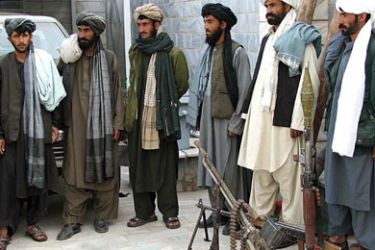 afp/ Former Afghan Taliban fighters look on during a ceremony in Herat province on March 9, 2009. Afghan President Hamid Karzai extended an olive-branch to Taliban militants in 2005 offering amnesty in return for giving up violence.