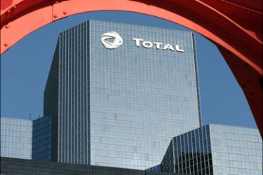 afp : (FILES) - Picture of headquarters of the French oil giant group Total taken on November 3, 2008 in La Defense, western Paris. Tyre maker Michelin, oil firm Total and sports