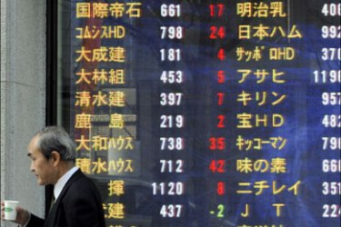 epa : epa01667658 A pedestrian walks past a stock market indicator board, in downtown Tokyo, Japan, 17 March 2009. Tokyo stocks rose for a third straight day, with the Nikkei