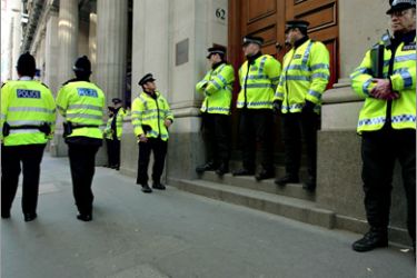 AFP - Police officers are pictured as protestors demonstrate ahead of the G-20 summit, in central London, on April 1, 2009. London is bracing for angry protests before and during