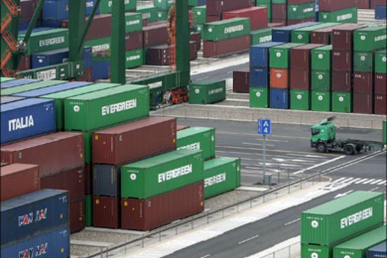 r : Containers are seen stacked up at the Port of Taipei in northern Taiwan April 7, 2009. Taiwan's exports in March fell 35.7 percent, in line with market expectations, data showed