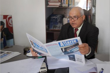 Ahmed Brahim (R), leader of Tunisia's opposition Ettajdid (Renewal) Movement, presidential candidate of a left-wing coalition and director of Attariq Aljadid newspaper is picture in his office