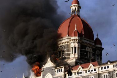 afp : FILES) In this picture taken on November 27, 2008, shows flames gushing out of The Taj Mahal Hotel in Mumbai. India's main political parties are talking tough on terror in the run-up