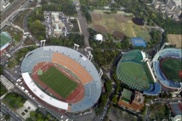 r : The main stadium of the 1964 Tokyo Summer Olympic Games is seen from a helicopter during a press tour organised by the Tokyo 2016 Bid Committee in Tokyo April