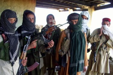 Armed Pakistani Taliban gather at a hideout in the semi-autonomous tribal district of Orakzai on April 22, 2009. Pakistan helicopter gunships raided suspected militant