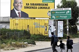 AFP - South African scholars walk past a billboard portraiting the ANC (African National Congress) leader Jacob Zuma in Khayelitsha township on the outskirt of Cape Town, on April 21, 2009 on the eve of South Africa's general elections. Polls tip the ANC to win at least 60 percent of the vote, with