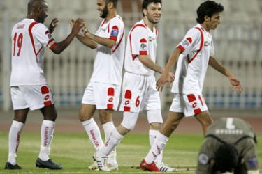 Faraj Laheeb of Kuwait's Al-Kuwait (L) celebrates with team mates after scoring against India's Mohun Bagan during their AFC Cup soccer match in Kuwait City