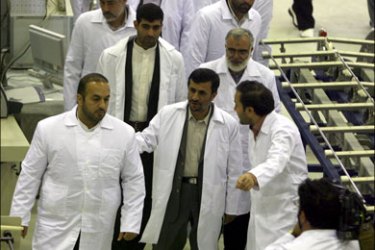 epa : epa01692717 Iranian President Mahmoud Ahmadinejad (front-C), walk with Iranian scientists, during the inauguration of the country's first nuclear fuel manufacturing plant (FMP),