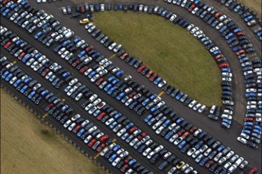 afp : (FILES) This file picture taken on December 18, 2008 shows thousands of new cars stored on the runway at the disused Upper Heyford airbase near Bicester, Oxfordshire.