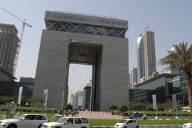 Traffic rolls past the Dubai Interntional Financial Center (DIFC) in the Gulf emirate on March 20, 2009. Faced with a sudden economic slowdown, Dubai is trying to combat the