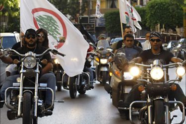f_Supporters of the Lebanese Forces party drive through the streets of Beirut on May 30, 2009. A total of 587 candidates have thrown their hats into the ring for Lebanon's