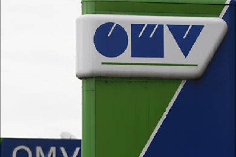 r_The logos of Austrian oil and gas group OMV are seen at a petrol station in Munich May 8, 2009. OMV reported a worse-than-expected 56 percent fall in clean operation earnings