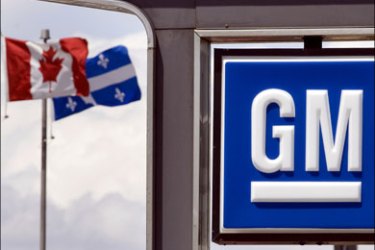 r : A General Motors dealership sign is seen in Montreal, May 31, 2009. General Motors Corp and the U.S. government finalized plans on Sunday for the battered automaker to