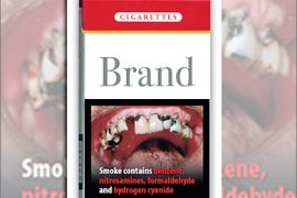 . AFP - bientot des images chocs sur les paquets de cigarettes" A handout photo released on the website of the European Commission's Public Health department of a picture-based Cigarette health warning label showing damaged teeth and reading "Smoke contains benzene" on a fake cigarettes box. France would force cigarette makers to put such label on the