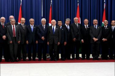 epa : epa01735810 Palestinian President Mahmoud Abbas (11-L) pictured with his new Palestinian government that will be led by Salam Fayyad as Prime Minister, after the