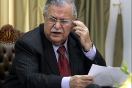 r : Iraq's President Jalal Talabani speaks to reporters during a news conference with Massoud Barzani, president of the Kurdish regional government in the Dokan tourist resort, 60