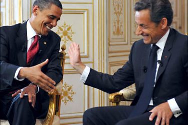 US President Barack Obama (L) shakes hands with French President Nicolas Sarkozy during a bilateral meeting at the Prefecture of Caen on June 6, 2009