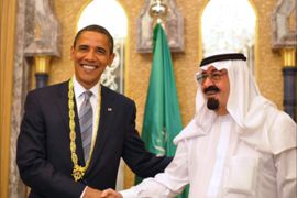 US President Barack Obama (L) shakes hands with Saudi King Abdullah bin Abdul Aziz al-Saud after he was presented with the King Abdul Aziz Order of Merit during a bilateral