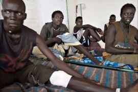 Nuer tribesmen recover at a clinic run by the medical charity Medecins Sans Frontieres (Doctors Without Borders) after receiving a gunshot wounds during a weekend clash