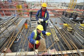 afp : Construction workers adjust metal rods as work continues on the main terminal of Berlin's new airport, the Berlin-Brandenburg International Airport (BBI) June 3, 2009.