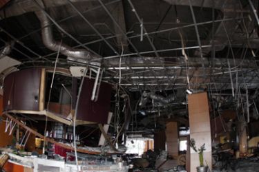 The damage inflicted by a bomb blast on a restaurant of the JW Marriot hotel is seen in Jakarta, July 18, 2009. Seven foreigners were among those killed in Friday's bomb attacks on two luxury hotels in Jakarta, the Jakarta Post newspaper reported on Saturday, citing a police official.