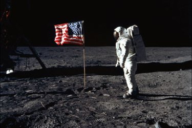 afp : FILES) -- This NASA handout photo taken on July 20, 1969 shows Astronaut Edwin E. Aldrin, Jr., lunar module pilot of the first lunar landing mission, posing beside the deployed United States flag during Apollo 11 Extravehicular Activity