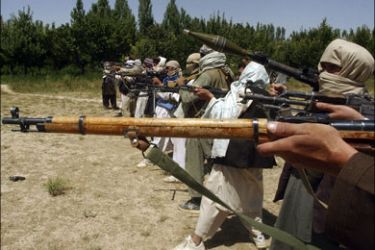 r : Taliban fighters train with their weapons in an undisclosed location in Afghanistan July 14, 2009. Around 4,000 U.S. Marines and hundreds of NATO and Afghan forces are taking