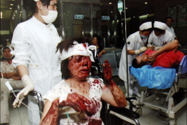 r : Medical staff attend to the wounded following riots in Urumqi, Xinjiang Autonomous Region, in China in this handout photo which officials say was taken in the late