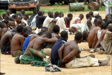 afp : Some members of the Islamic fundamentalists were regrouped after they were arrested during a crossfire with the police in Bauchi, northern Nigeria on July 26, 2009. Dozens
