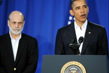 afp : US President Barack Obama speaks as Ben Bernanke looks on at the Oak Bluffs school on Martha's Vineyard, Massachusetts, on August 25, 2009. After a brutal seven