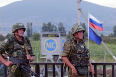 )Russian peacekeepers guard on their outpost at South Ossetian border in an unknown location in Georgia on August 7, 2008