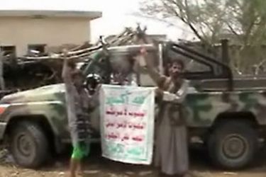 An image grab from an undated handout video distributed on September 8, 2009 by the office of Abdel Malek al-Huthi, the leader of Yemen's Zaidi rebels, allegedly shows members of his group, also known as al-Huthis, posing in front of a military vehicle they seized from an army post during battles in the northwestern Saada